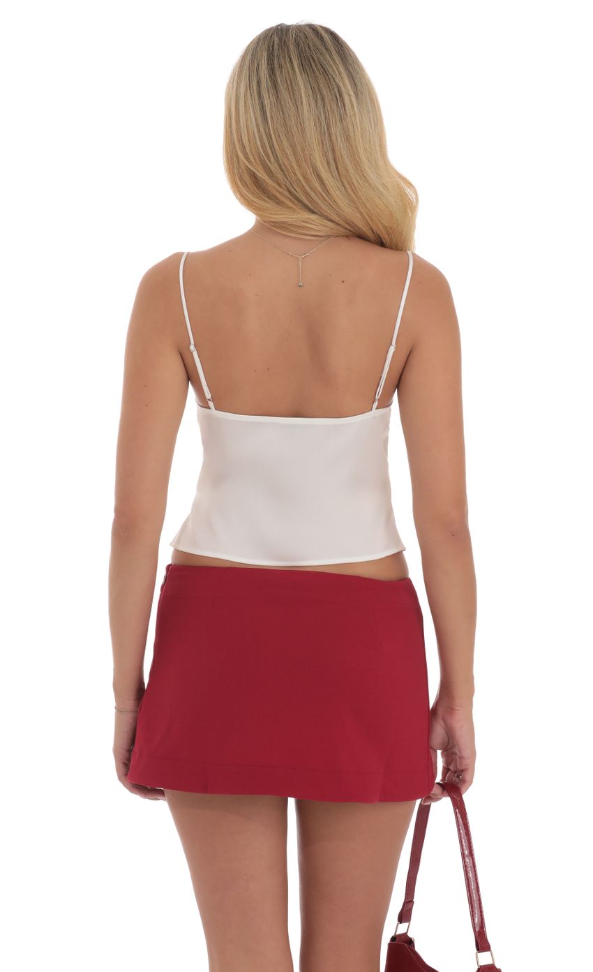 Picture Cutout Ties Satin Top in White. Source: https://media-img.lucyinthesky.com/data/Sep24/850xAUTO/81746538-60c2-488a-93dc-a11053c0ab2e.jpg