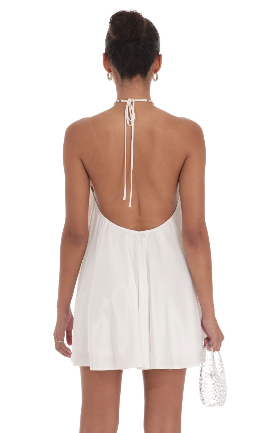 Picture Pearl Halter Shift Dress in White. Source: https://media-img.lucyinthesky.com/data/Sep24/850xAUTO/974b3556-b68d-4091-a98f-bbcc07311d2a.jpg