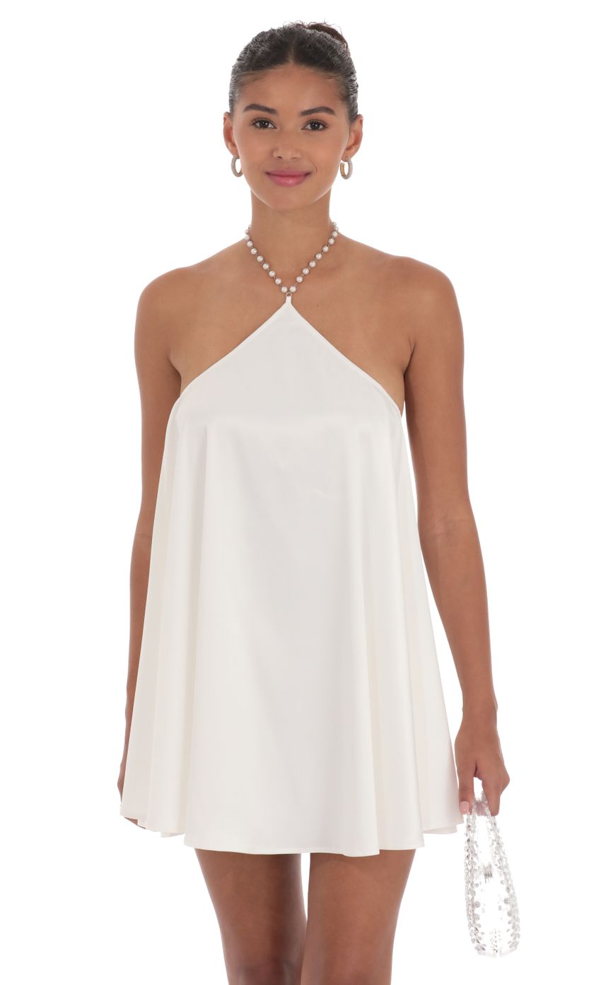 Picture Pearl Halter Shift Dress in White. Source: https://media-img.lucyinthesky.com/data/Sep24/850xAUTO/9983da7e-b7df-4864-9037-451559f235d5.jpg