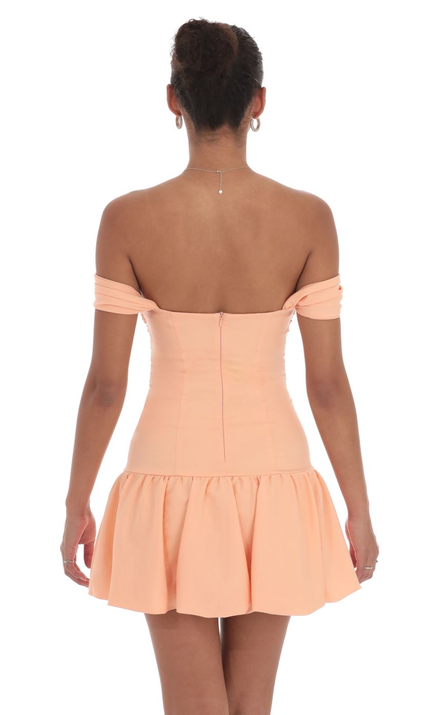 Picture Off Shoulder Cutout Bubble Dress in Orange. Source: https://media-img.lucyinthesky.com/data/Sep24/850xAUTO/b5e70265-43b3-44e0-8166-a738f0db6058.jpg