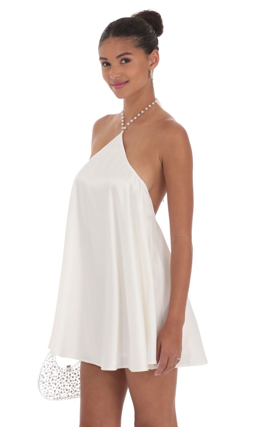 Picture Pearl Halter Shift Dress in White. Source: https://media-img.lucyinthesky.com/data/Sep24/850xAUTO/b6a3c6c0-7d21-46fd-8fb9-10df12a58c04.jpg