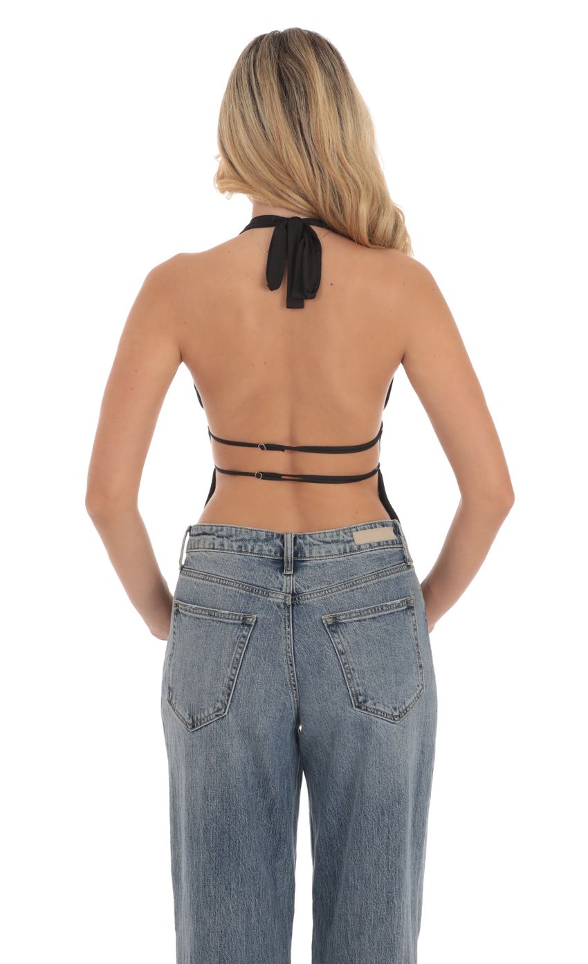 Picture Halter Open Back Top in Black. Source: https://media-img.lucyinthesky.com/data/Sep24/850xAUTO/cec91103-d56c-41c1-a837-580b061426ef.jpg