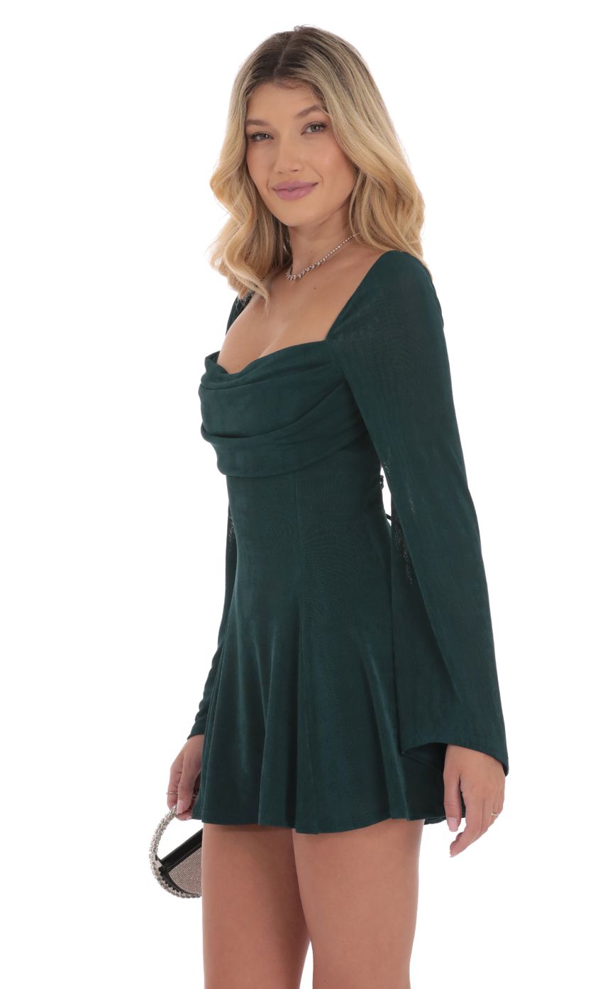 Picture Slinky Flare Sleeve Dress in Dark Green. Source: https://media-img.lucyinthesky.com/data/Sep24/850xAUTO/db1fe46f-391a-45cd-9964-4d0fa37e3007.jpg