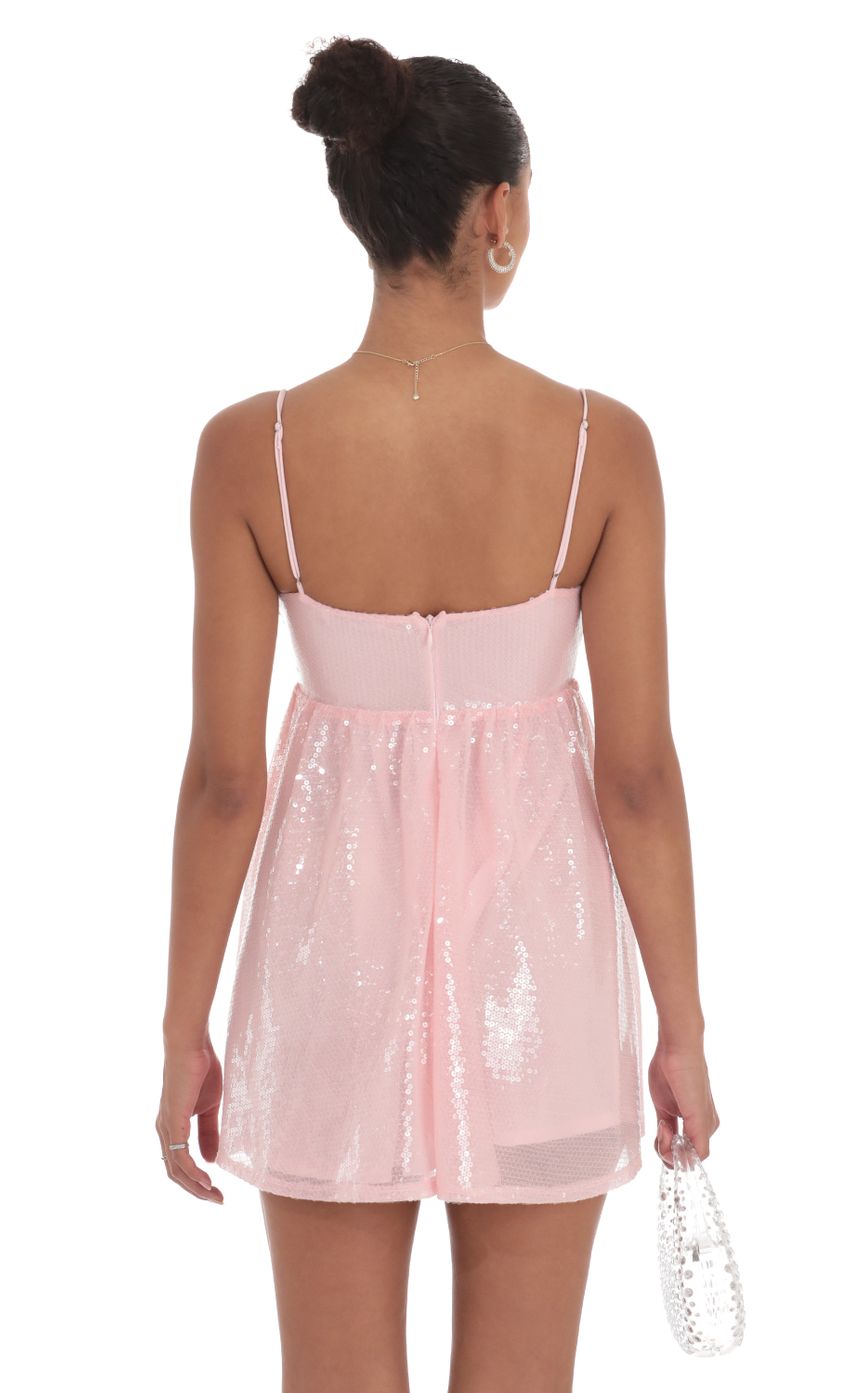 Picture Sequin Front Bow Babydoll Dress in Pink. Source: https://media-img.lucyinthesky.com/data/Sep24/850xAUTO/e7e6a9ad-5408-489b-9fb5-47c5e0a42998.jpg