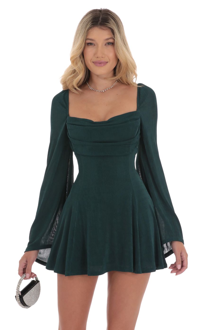 Picture Slinky Flare Sleeve Dress in Dark Green. Source: https://media-img.lucyinthesky.com/data/Sep24/850xAUTO/f00ae494-fbbc-47f1-b552-a3487b746c34.jpg