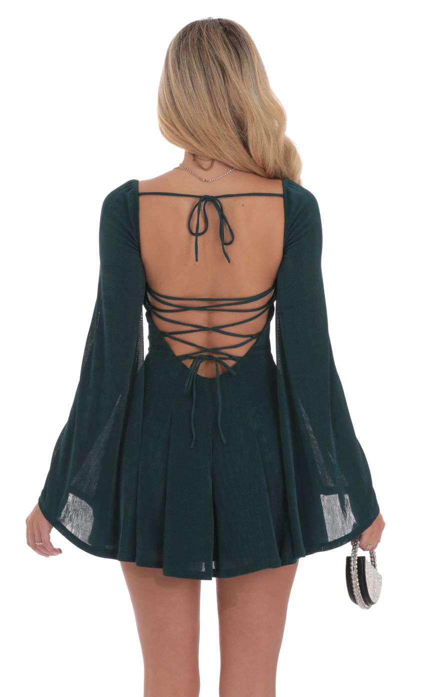 Picture Slinky Flare Sleeve Dress in Dark Green. Source: https://media-img.lucyinthesky.com/data/Sep24/850xAUTO/f39ea31d-c1c5-42a6-8f77-9d8728bcd264.jpg