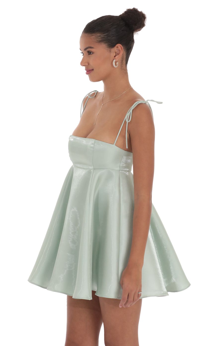 Picture Sheen Flare Babydoll Dress in Sage Green. Source: https://media-img.lucyinthesky.com/data/Sep24/850xAUTO/f3de3efb-07d4-4b32-a864-a91e31e58fa2.jpg