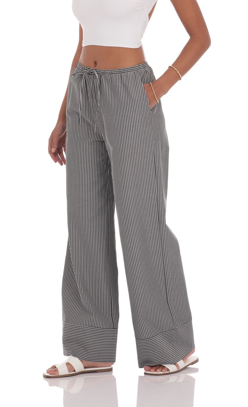 Picture Pinstripe Straight leg Pants in Grey. Source: https://media-img.lucyinthesky.com/data/product-media/850xAUTO/00bcd98f-b9ef-49d8-9145-4e5f5111d38a.jpg