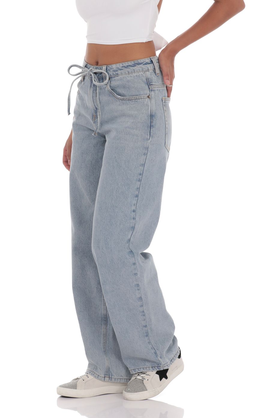 Picture Drawstring Denim Jeans in Blue. Source: https://media-img.lucyinthesky.com/data/product-media/850xAUTO/08b43468-1404-482c-a08c-7516a88ffc6d.jpg