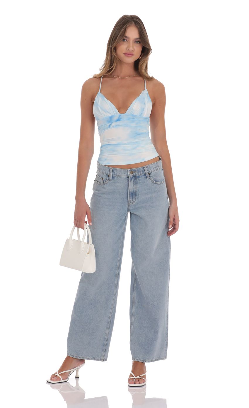 Picture Swirl Mesh V-Neck Top in Blue. Source: https://media-img.lucyinthesky.com/data/product-media/850xAUTO/0cc4433a-39c8-4ddf-a4eb-555248c1c358.jpg