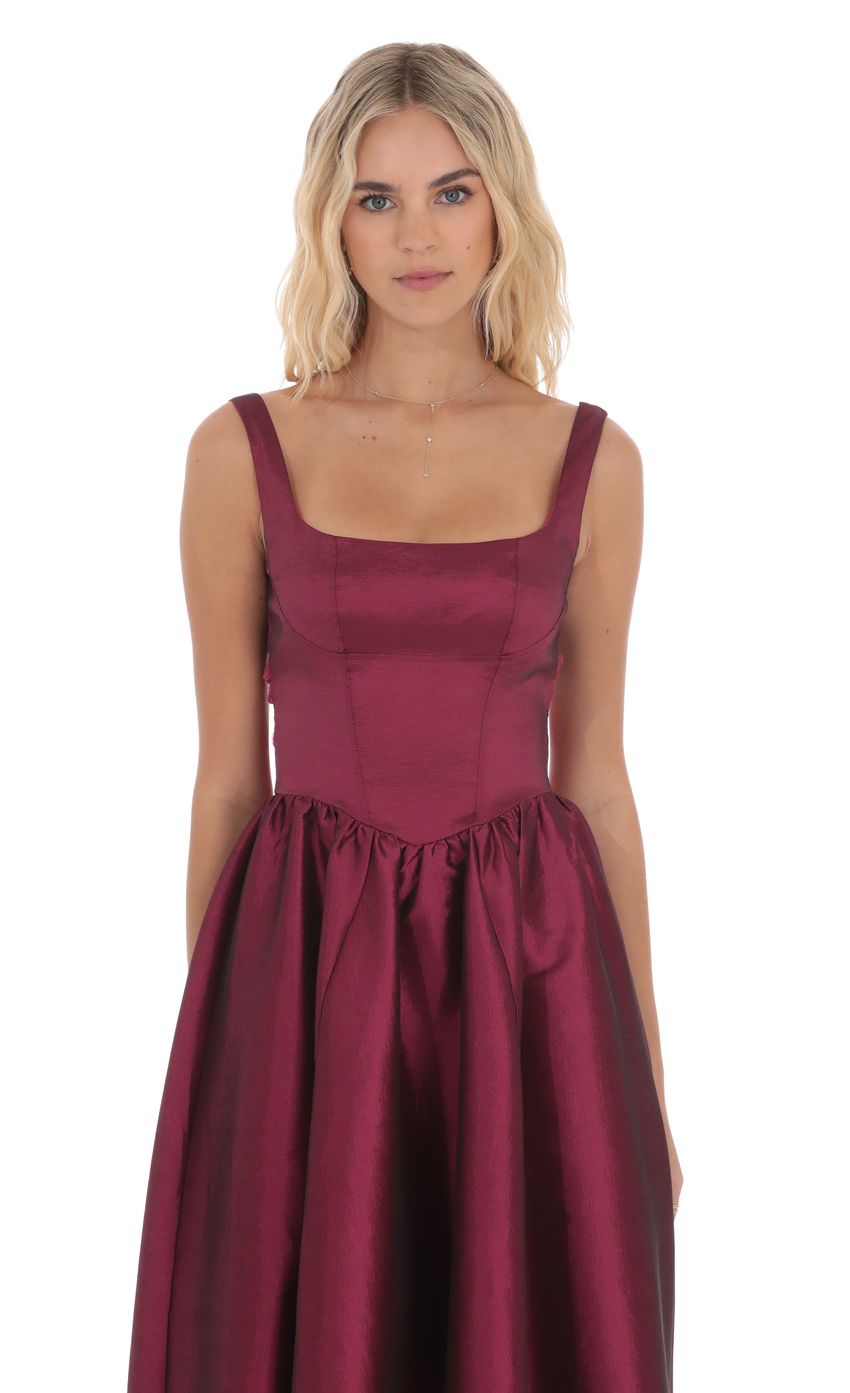 Picture Back Bow Gown in Plum. Source: https://media-img.lucyinthesky.com/data/product-media/850xAUTO/0fb079e1-4d5a-4efb-ae88-306b730e2f36.jpg