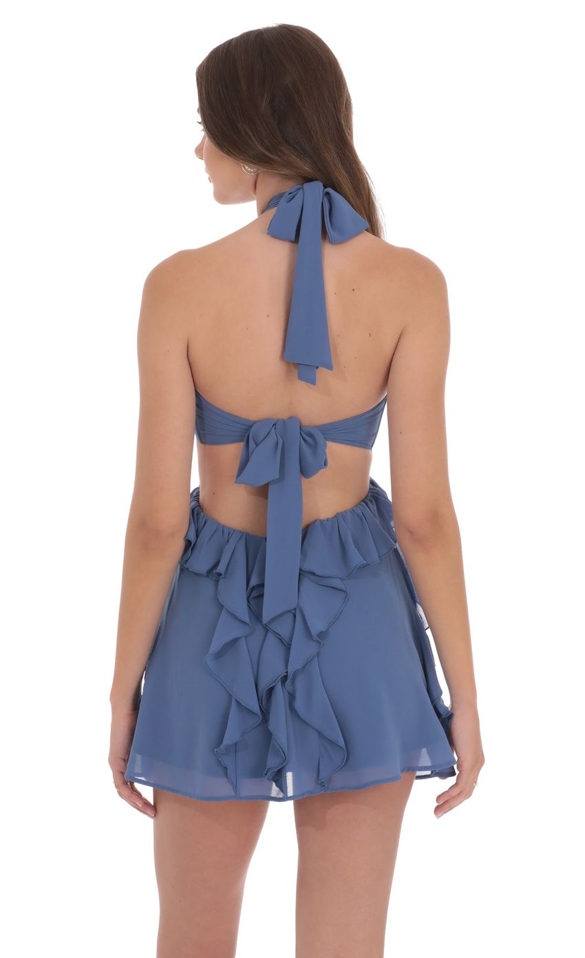 Picture Chiffon Cutout Ruffle Dress in Denim Blue. Source: https://media-img.lucyinthesky.com/data/product-media/850xAUTO/0fdca5df-2670-47b6-a7c4-91a168644f46.jpg