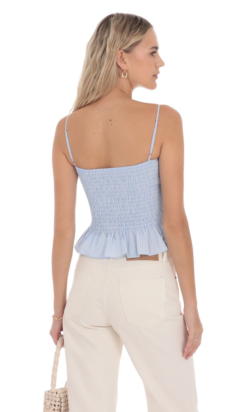 Picture Smocked Striped Button Top in Blue. Source: https://media-img.lucyinthesky.com/data/product-media/850xAUTO/113949e6-f035-4d65-b0fd-c5acf9ee13cb.jpg