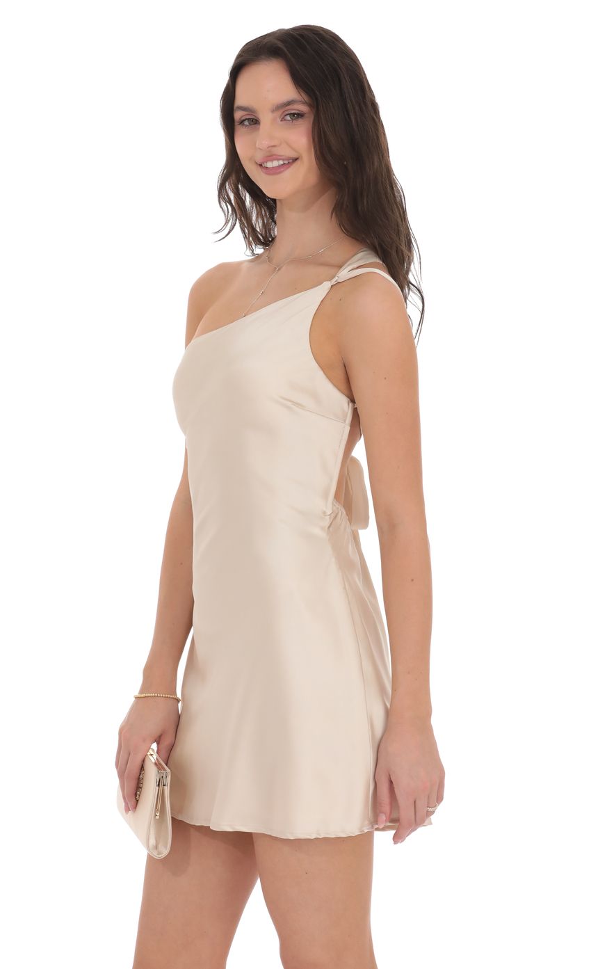 Picture Satin One Shoulder Open Back Dress in Champagne. Source: https://media-img.lucyinthesky.com/data/product-media/850xAUTO/1a6a1c9d-4707-4f43-9bf5-361eebf7ef8a.jpg