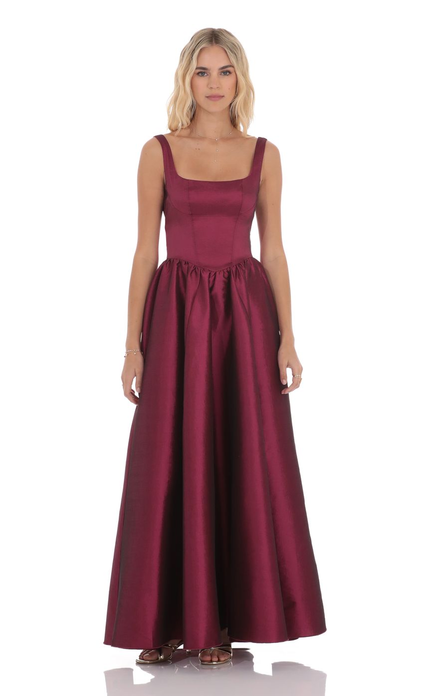 Picture Back Bow Gown in Plum. Source: https://media-img.lucyinthesky.com/data/product-media/850xAUTO/1b127507-5ed7-468c-aa71-39aef341e29f.jpg