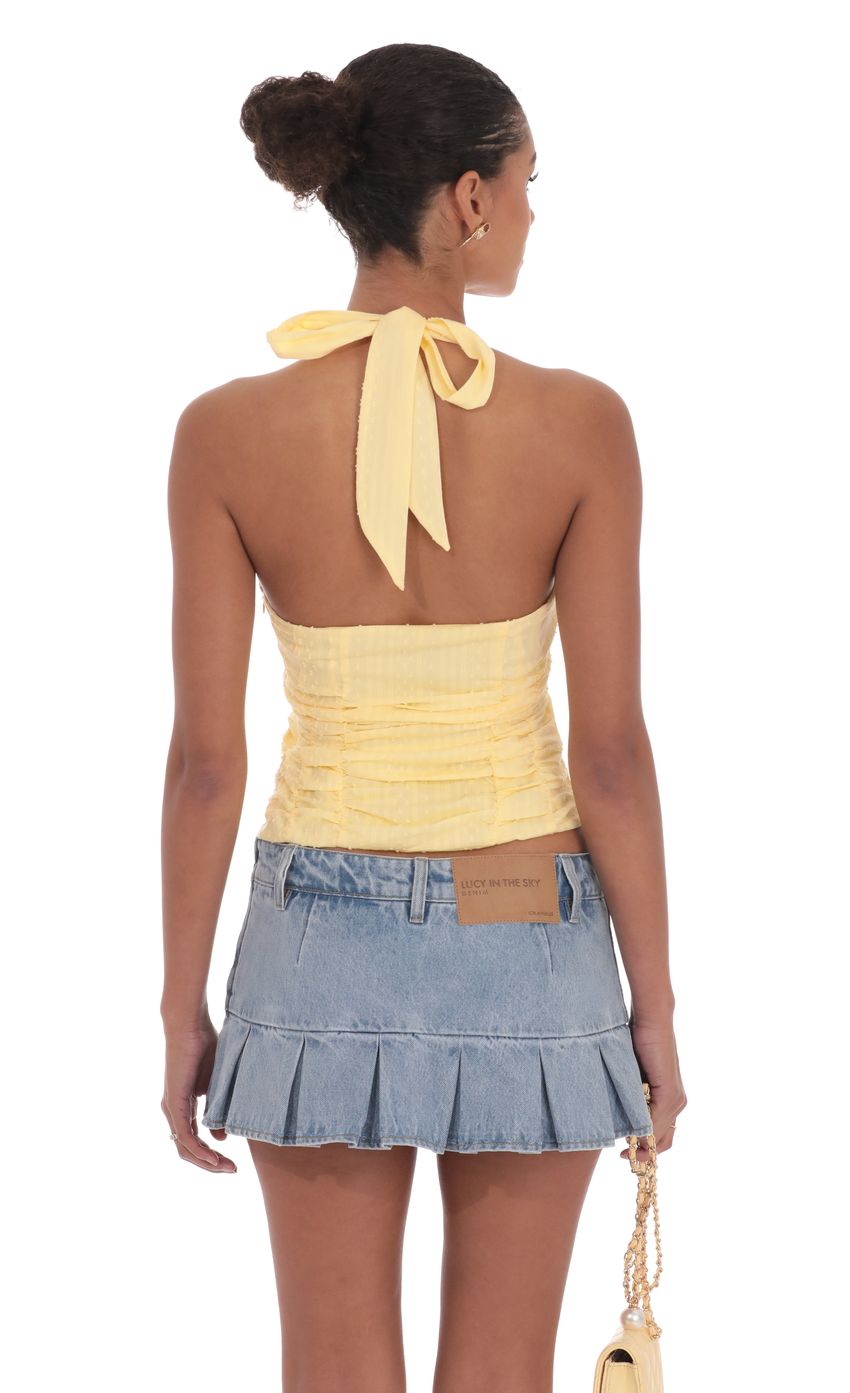 Picture Dotted Halter Top in Yellow. Source: https://media-img.lucyinthesky.com/data/product-media/850xAUTO/1bfbcf7a-9c3a-46dd-b00c-3cf4e3457d49.jpg