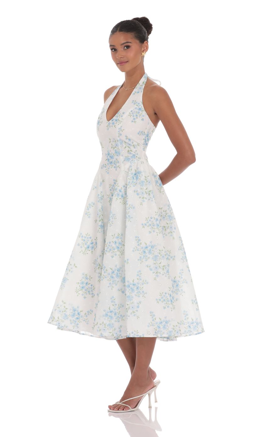 Picture Floral V-Neck Midi Dress in White. Source: https://media-img.lucyinthesky.com/data/product-media/850xAUTO/1cfa07d2-baff-49a1-930e-1127df36ab32.jpg