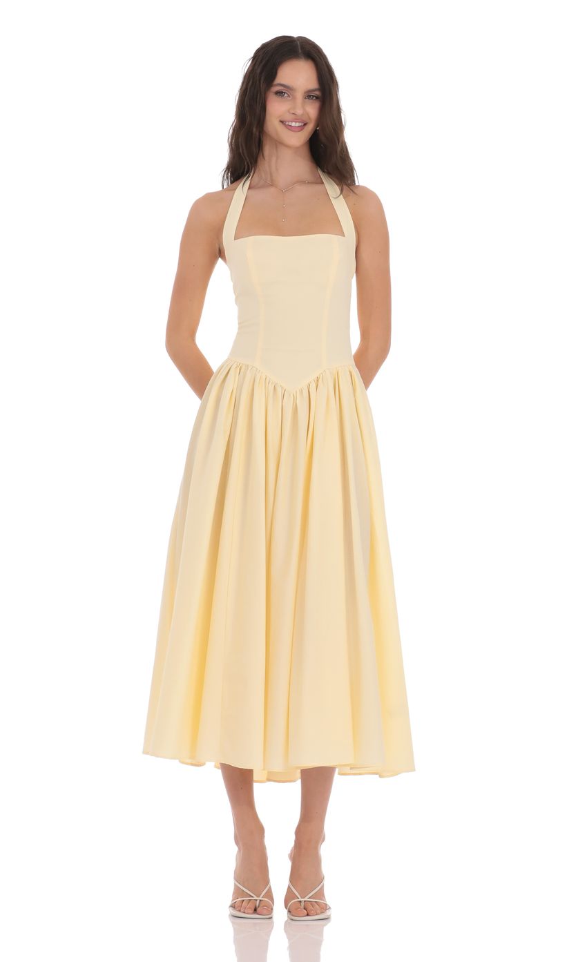 Picture Halter Midi Dress in Yellow. Source: https://media-img.lucyinthesky.com/data/product-media/850xAUTO/224542b0-513c-4d1b-94c3-8562ad330940.jpg