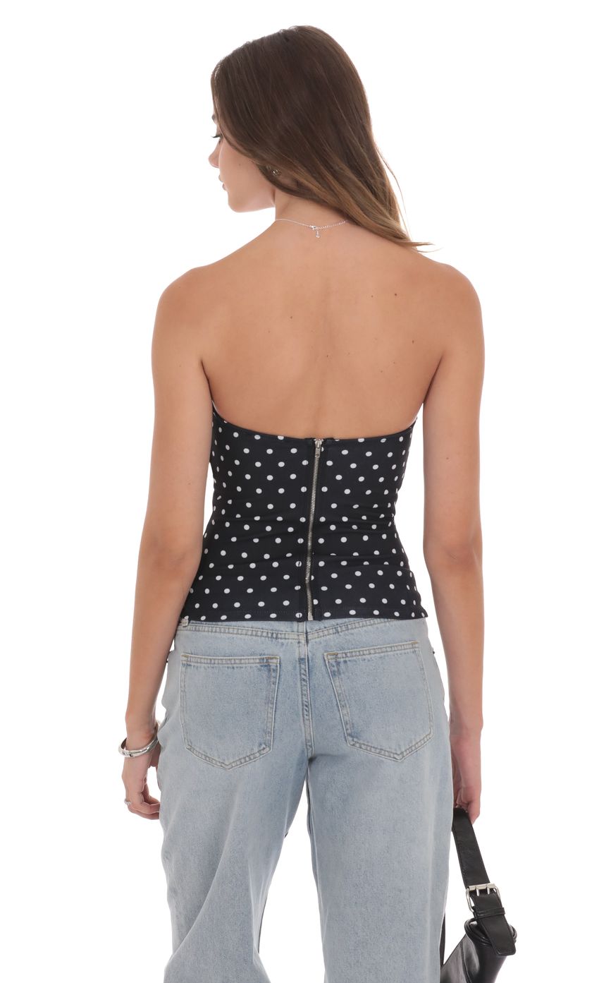 Picture Polka Dot Strapless Buckle Top in Black. Source: https://media-img.lucyinthesky.com/data/product-media/850xAUTO/29ef9e7d-a388-49da-b7f0-3d55a17b3dfc.jpg