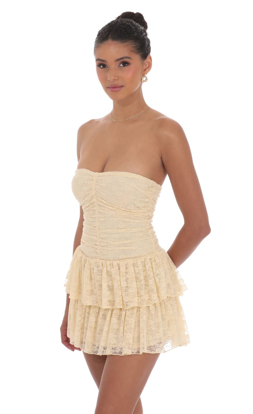 Picture Lace Strapless Ruched Ruffle Dress in Beige. Source: https://media-img.lucyinthesky.com/data/product-media/850xAUTO/30d356e8-4d29-4c0d-8ef6-2f206b7f4dfb.jpg