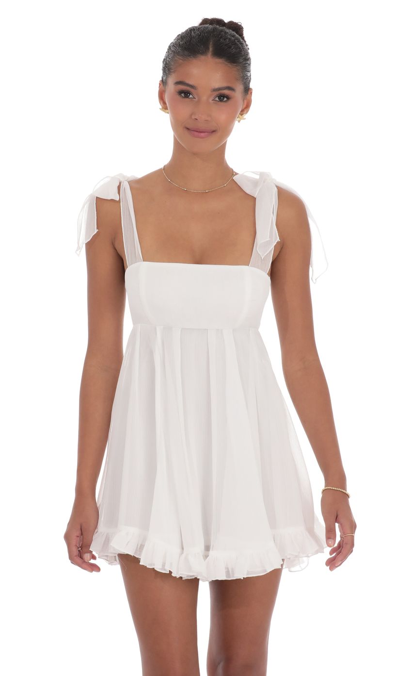 Picture Shimmer Ruffle Babydoll Dress in White. Source: https://media-img.lucyinthesky.com/data/product-media/850xAUTO/3a5158cd-4343-4626-8c3f-1f56c9db1009.jpg