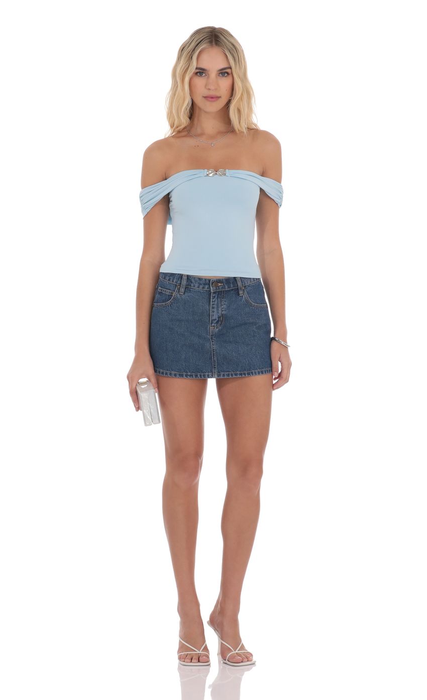 Picture Embellished Off Shoulder Top in Light Blue. Source: https://media-img.lucyinthesky.com/data/product-media/850xAUTO/3fcf3302-0fa6-4e43-90d9-12cbd5216137.jpg