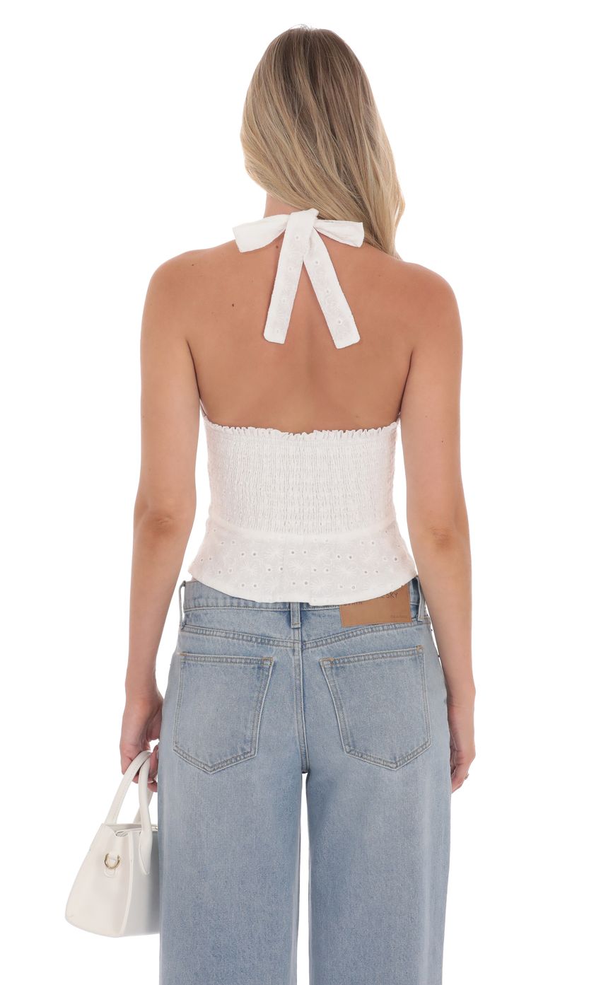 Picture Floral Eyelet Halter Top in White. Source: https://media-img.lucyinthesky.com/data/product-media/850xAUTO/42672a21-ca03-451e-b4b3-89bdd913ee90.jpg