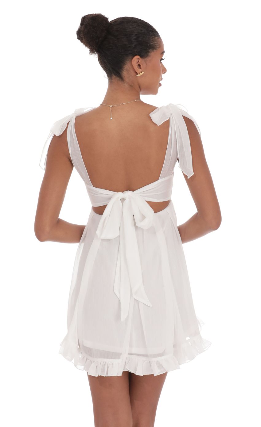 Picture Shimmer Ruffle Babydoll Dress in White. Source: https://media-img.lucyinthesky.com/data/product-media/850xAUTO/43626ff3-0334-4fd3-952b-aef109dba88b.jpg