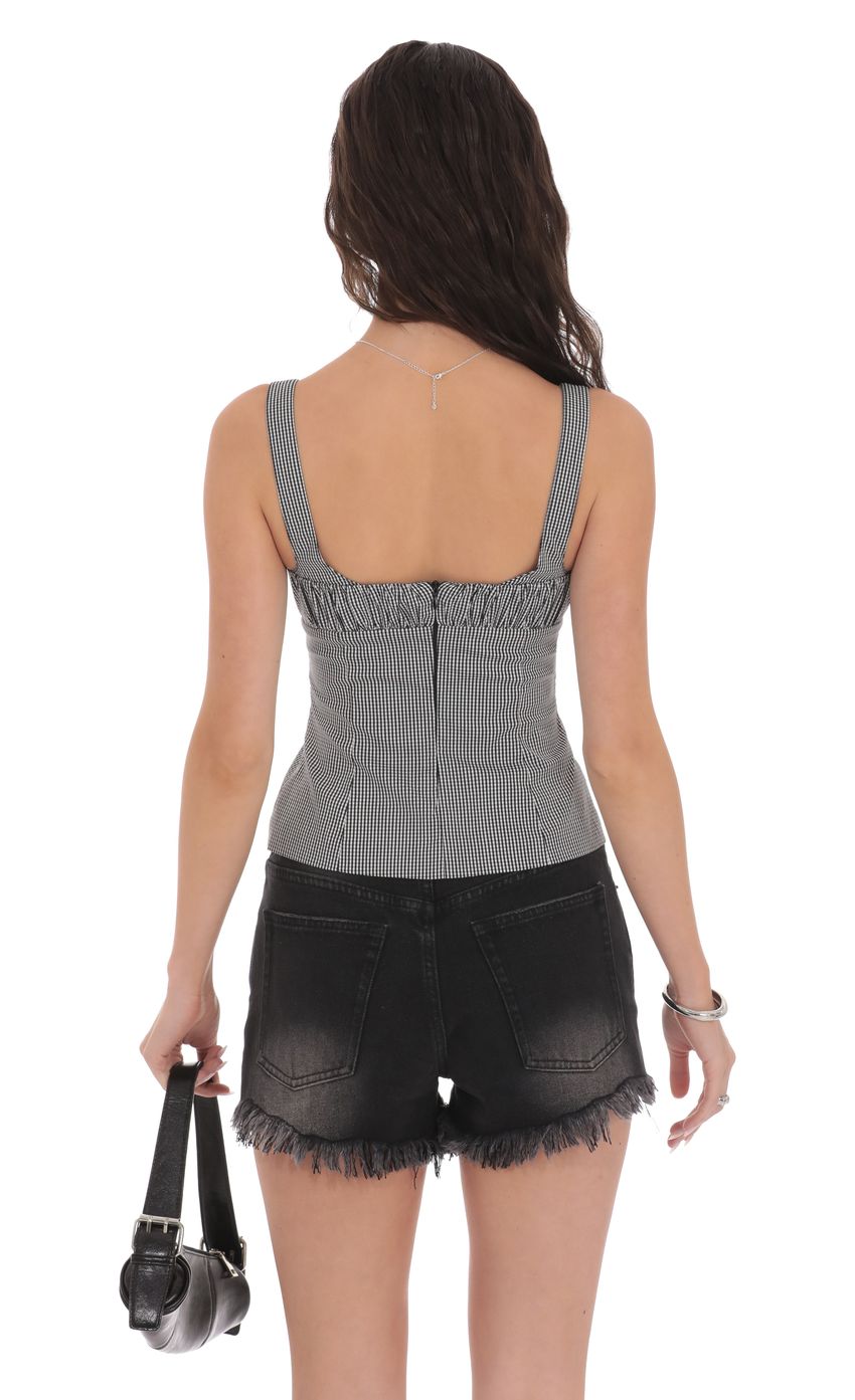 Picture Ruched Gingham Top in Black and White. Source: https://media-img.lucyinthesky.com/data/product-media/850xAUTO/447fc462-d4c4-4232-9c0e-676cea61b656.jpg
