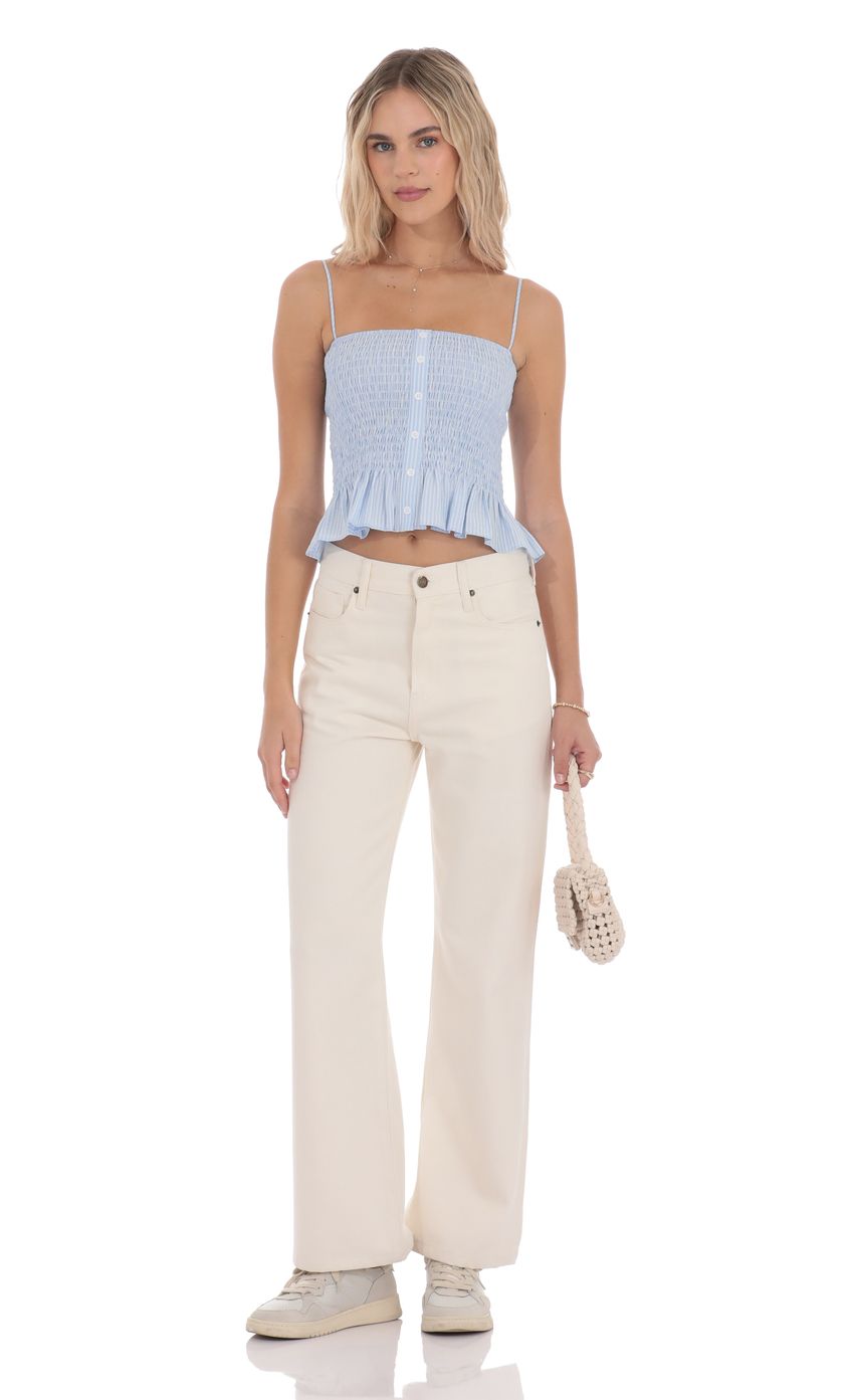 Picture Smocked Striped Button Top in Blue. Source: https://media-img.lucyinthesky.com/data/product-media/850xAUTO/4504eb1b-98c5-472c-acac-c10ce97dc4c5.jpg