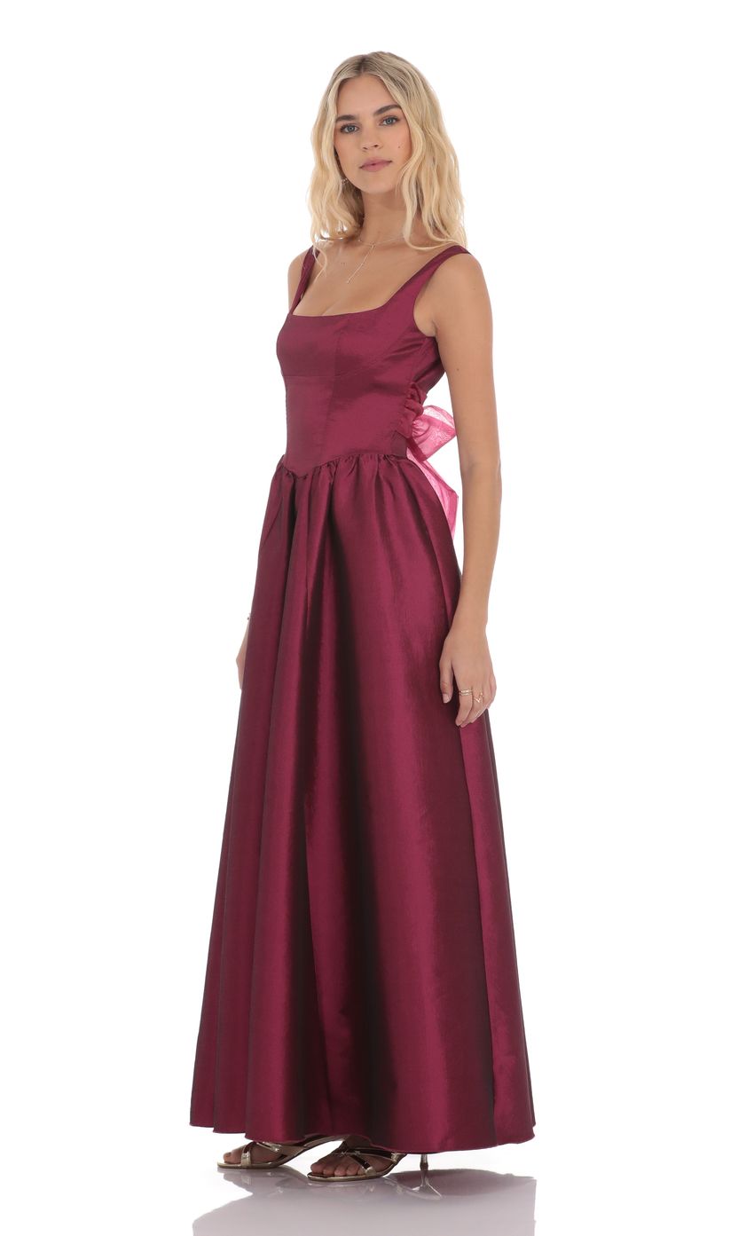 Picture Back Bow Gown in Plum. Source: https://media-img.lucyinthesky.com/data/product-media/850xAUTO/455f3db4-6e2a-4da4-968e-1b315d44d3ee.jpg