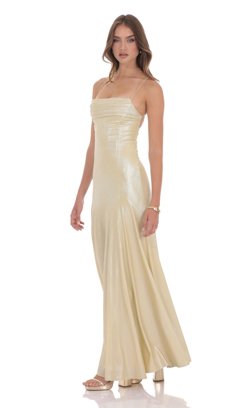 Picture Shimmer Draped Open Back Maxi Dress in Gold. Source: https://media-img.lucyinthesky.com/data/product-media/850xAUTO/48ac6f84-fc7d-4fe8-b6ad-ea2333898f71.jpg