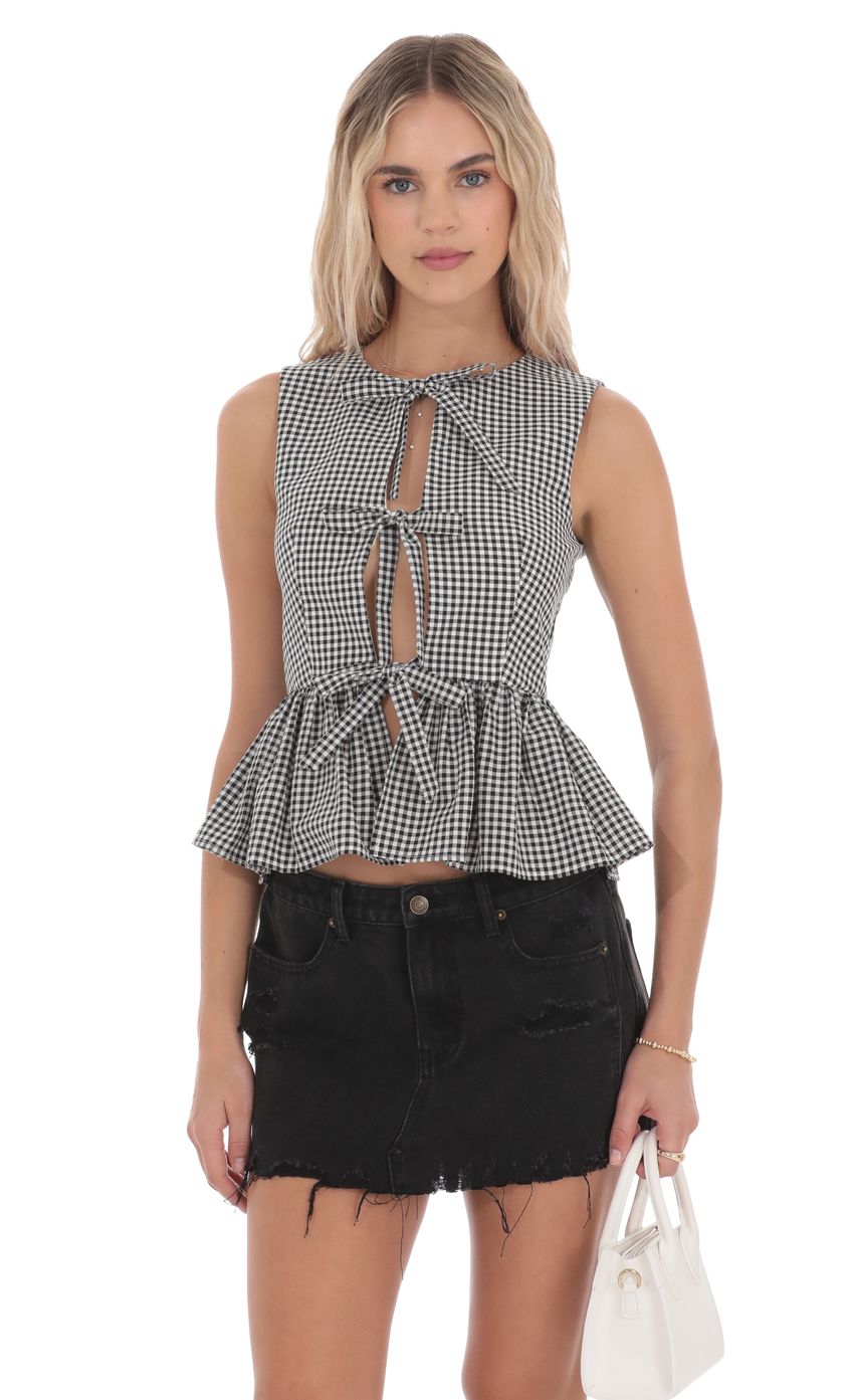 Picture Gingham Peplum Vest in Black and White. Source: https://media-img.lucyinthesky.com/data/product-media/850xAUTO/4cca5ccb-39e2-4bcc-9943-4b7b8a78e49e.jpg