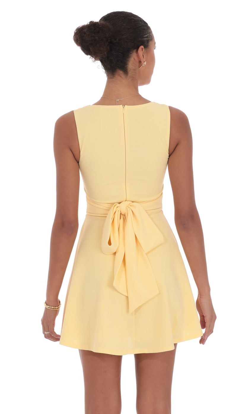 Picture Back Bow A-Line Dress in Yellow. Source: https://media-img.lucyinthesky.com/data/product-media/850xAUTO/4d146823-1d25-492c-9283-d90d0f5aeb0b.jpg