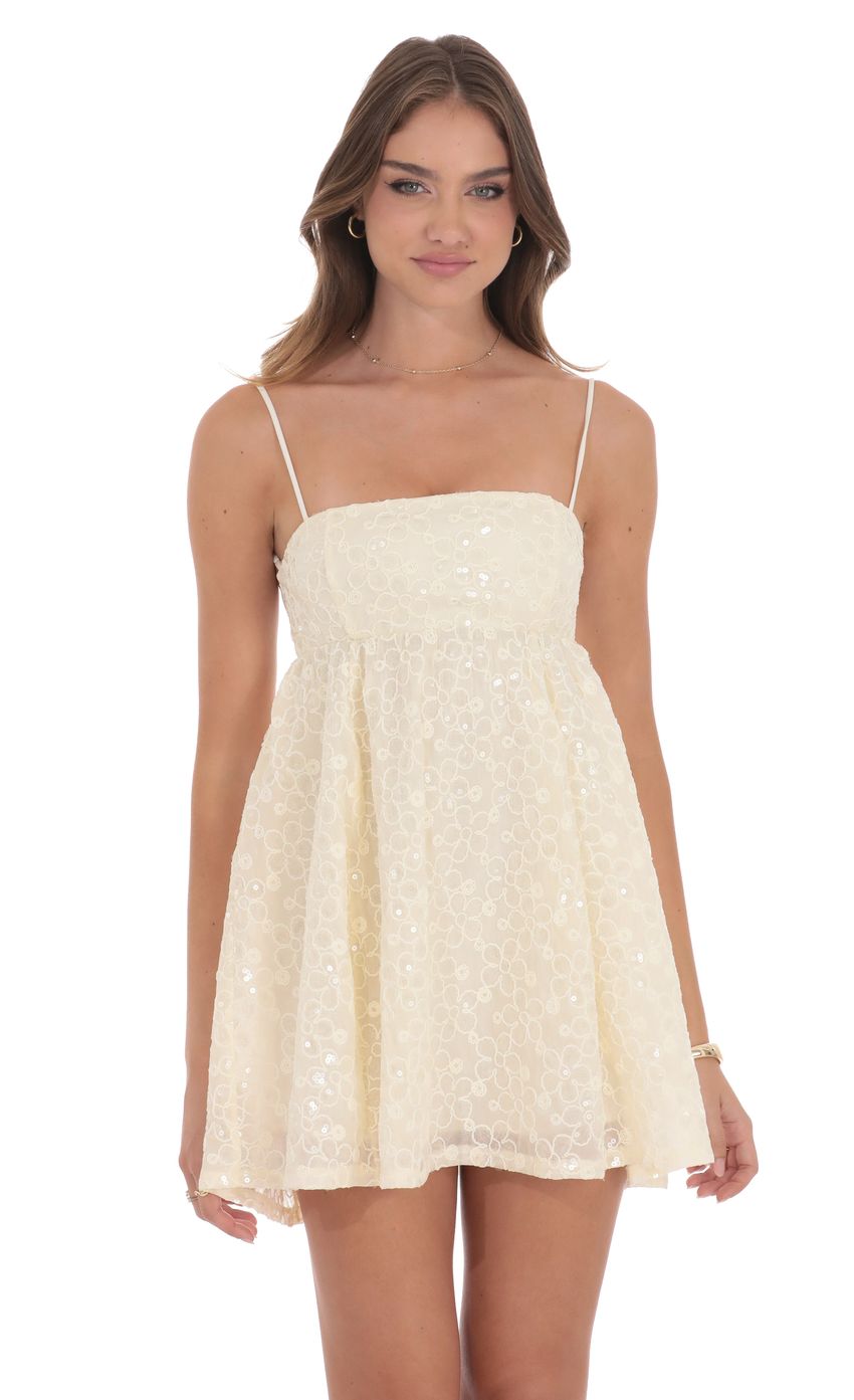 Picture Floral Sequin Babydoll Dress in Cream. Source: https://media-img.lucyinthesky.com/data/product-media/850xAUTO/4f882691-c0e5-4064-a243-09a833cc799c.jpg