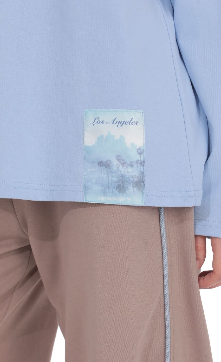 Product image for Lucy Graphic Crewneck Shirt in Light Blue