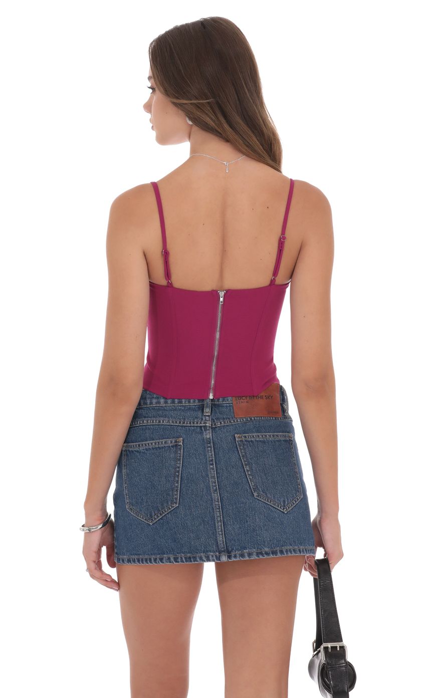 Picture Pointed Corset Top in Magenta. Source: https://media-img.lucyinthesky.com/data/product-media/850xAUTO/51ad21ff-ae43-493f-b486-47e6a5c4c6c7.jpg