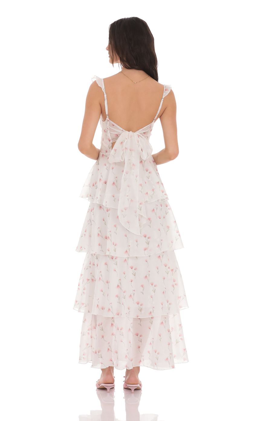 Picture Floral Ruffle Maxi Dress in White. Source: https://media-img.lucyinthesky.com/data/product-media/850xAUTO/546df2fb-9c3a-481b-8c7e-8ad24336de75.jpg