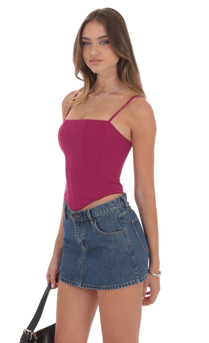 Picture Pointed Corset Top in Magenta. Source: https://media-img.lucyinthesky.com/data/product-media/850xAUTO/55fddcdd-07bc-400d-b771-780b45f61d1e.jpg