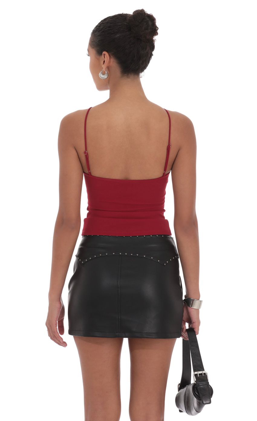 Picture Studded Belt Faux Leather Skirt in Black. Source: https://media-img.lucyinthesky.com/data/product-media/850xAUTO/58b82e19-f92d-423c-b4c8-8881a9bd6110.jpg