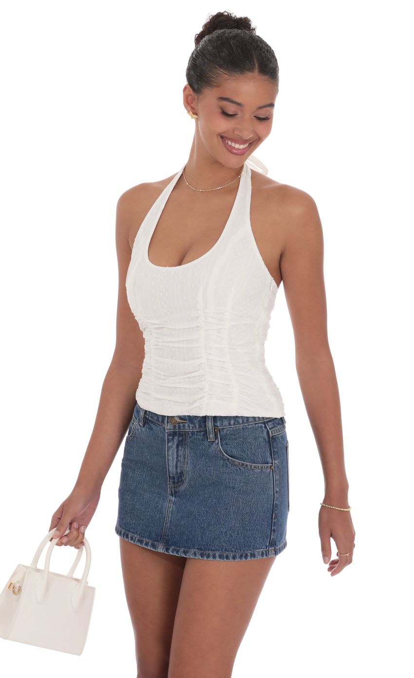 Picture Dotted Halter Top in White. Source: https://media-img.lucyinthesky.com/data/product-media/850xAUTO/5e8c9e4d-2fca-4e70-af26-080a79a0327c.jpg