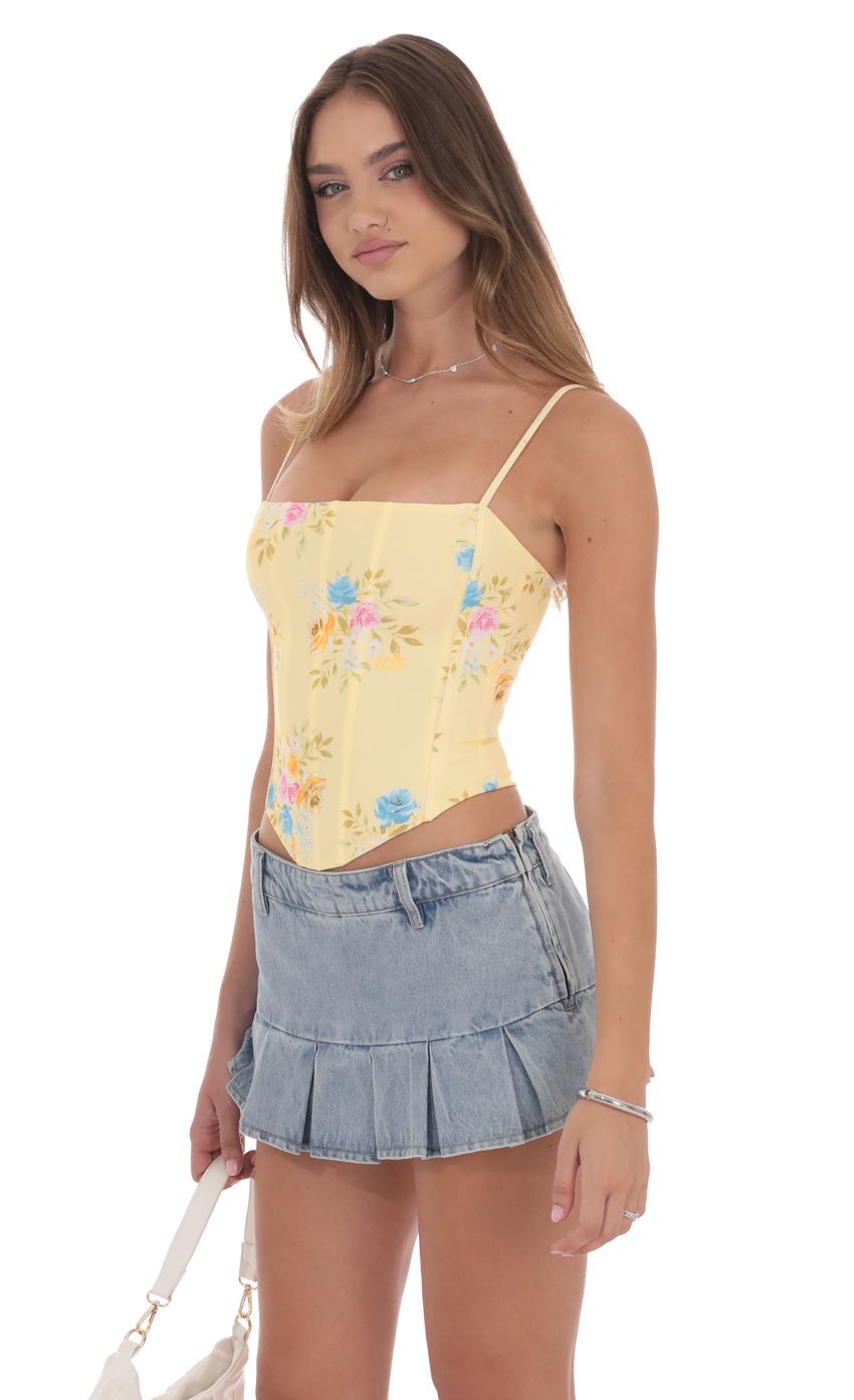 Picture Pointed Floral Corset Top in Yellow. Source: https://media-img.lucyinthesky.com/data/product-media/850xAUTO/5f240d69-7894-43bc-b716-401cc1825361.jpg