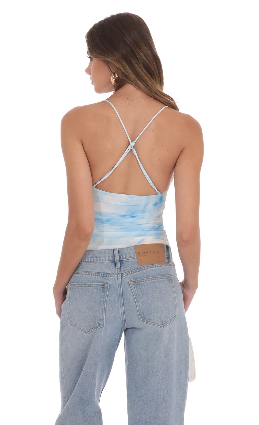 Picture Swirl Mesh V-Neck Top in Blue. Source: https://media-img.lucyinthesky.com/data/product-media/850xAUTO/60479c16-4cbc-4bc3-94b9-d9f81128a89d.jpg