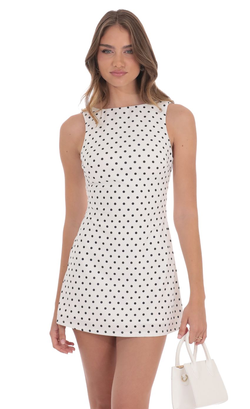 Picture Polka Dot High Neck Back Bow Dress in White. Source: https://media-img.lucyinthesky.com/data/product-media/850xAUTO/6150907a-03a8-4500-95df-5e70ef7308fc.jpg