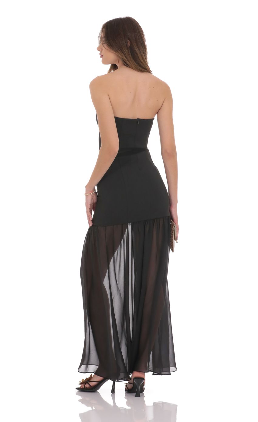 Picture Strapless Chiffon Drop Skirt Maxi Dress in Black. Source: https://media-img.lucyinthesky.com/data/product-media/850xAUTO/63786983-1ba0-4dcc-a725-cc1783b338a5.jpg