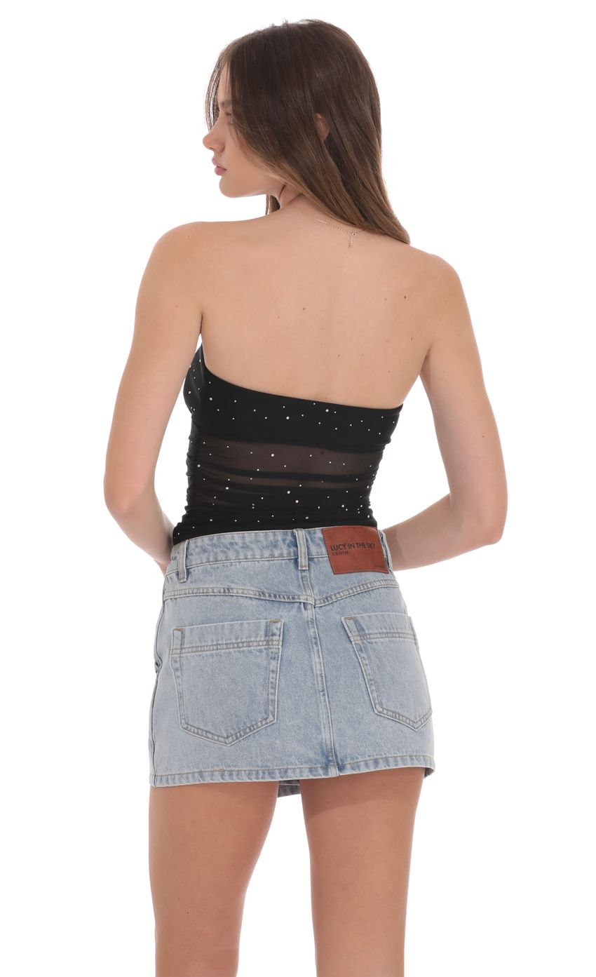 Picture Overlap Button Denim Skirt in Light Blue. Source: https://media-img.lucyinthesky.com/data/product-media/850xAUTO/638cd1b6-9a1f-4909-9290-f5a7a4986108.jpg