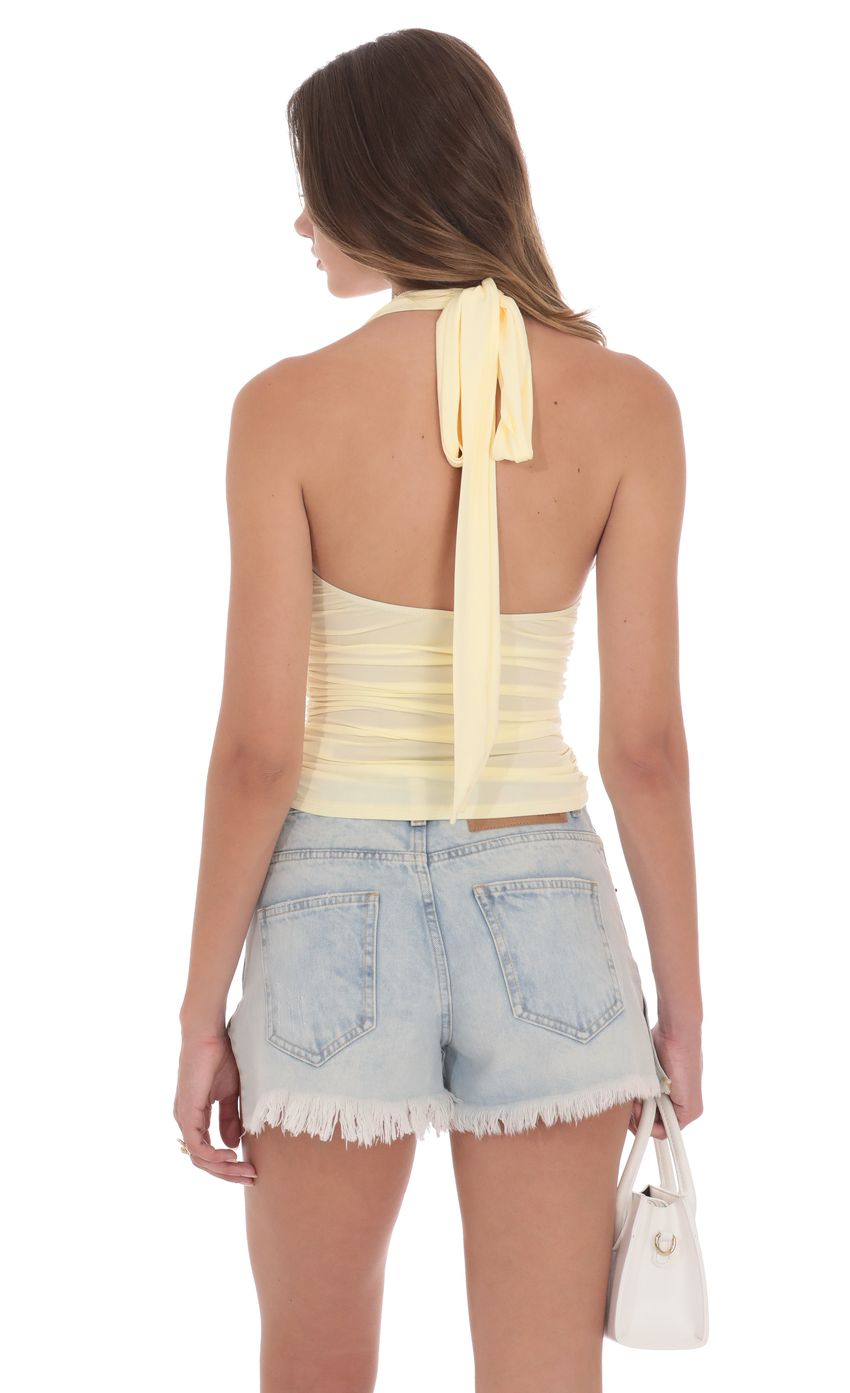 Picture Halter Ruched Top in Yellow. Source: https://media-img.lucyinthesky.com/data/product-media/850xAUTO/661072a9-5e0b-4025-90ea-8631162715fd.jpg
