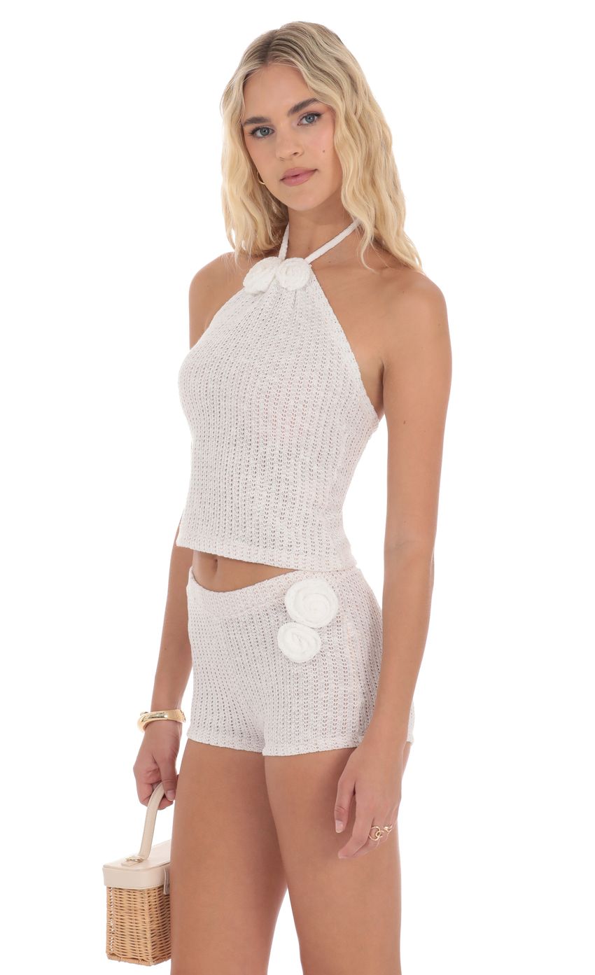 Picture Crochet Rosette Halter Top in White. Source: https://media-img.lucyinthesky.com/data/product-media/850xAUTO/66cbf919-6345-4d67-b6ea-02f3efe3b96f.jpg
