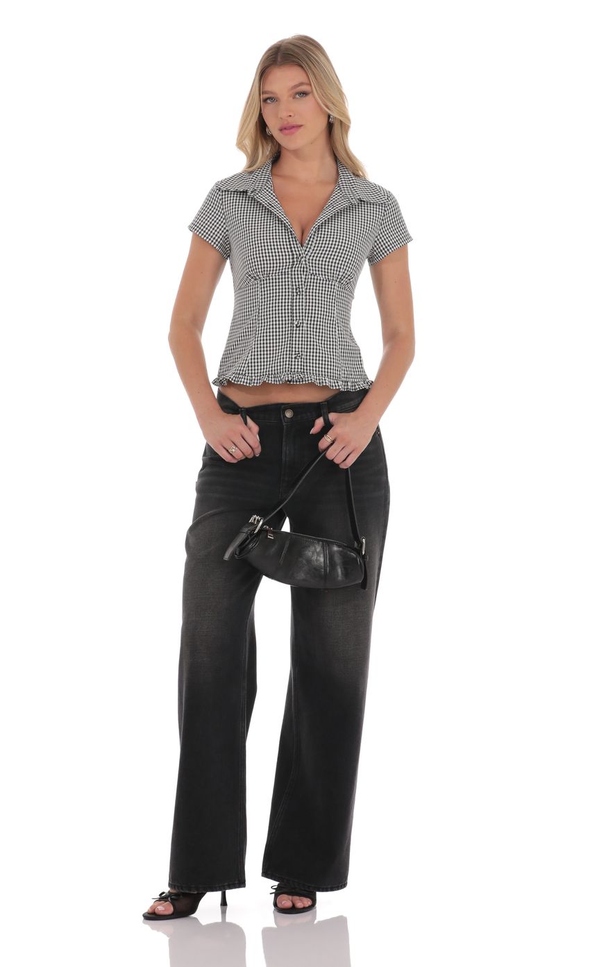 Picture Button-Up Ruffle Top in Black Gingham. Source: https://media-img.lucyinthesky.com/data/product-media/850xAUTO/68e49cb5-6f6c-4770-a2fa-490b4e485456.jpg