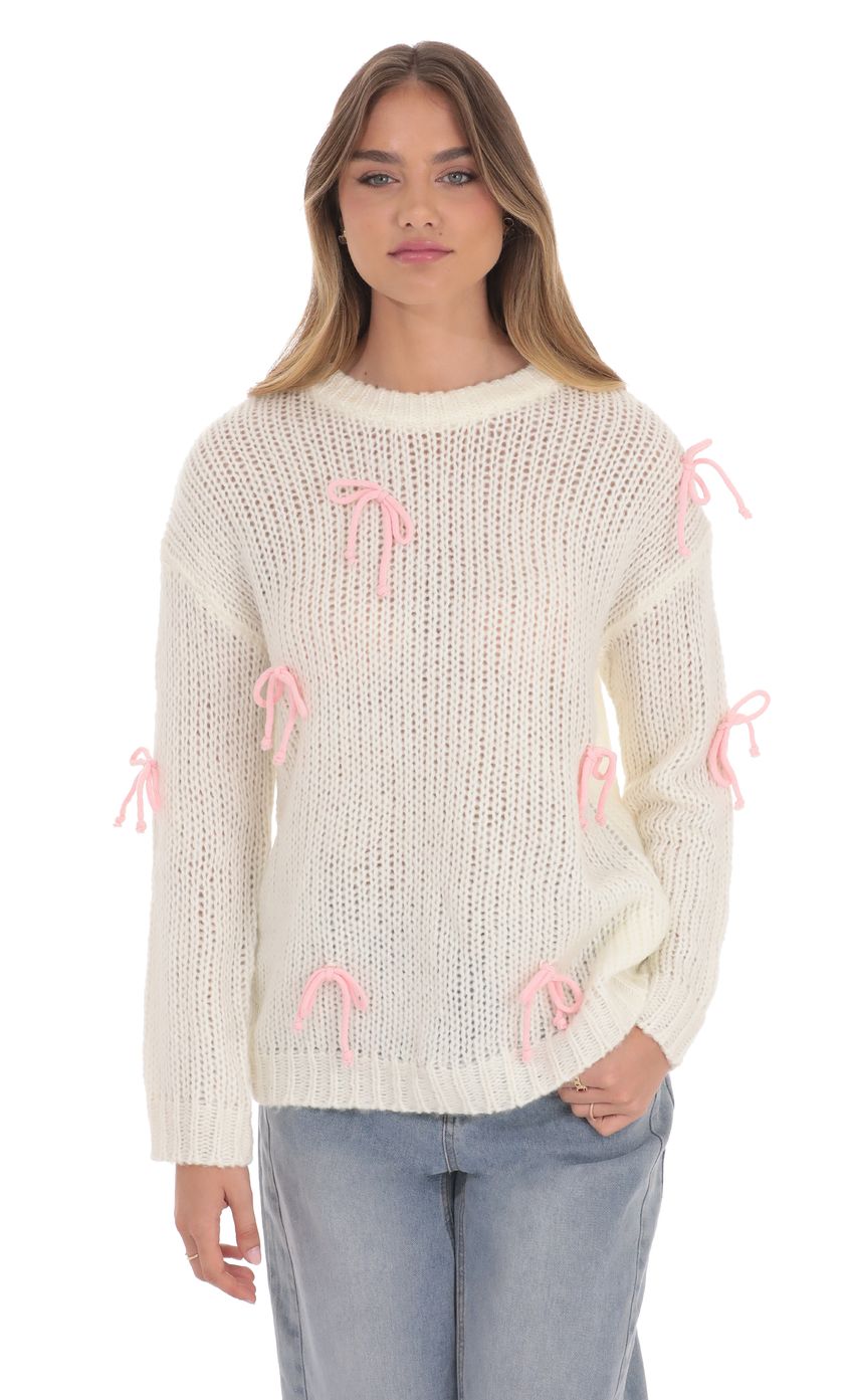 Picture Knitted Bows Jumper in Cream. Source: https://media-img.lucyinthesky.com/data/product-media/850xAUTO/6a1b7f28-7ba0-4c6f-9855-4c545a88a895.jpg